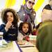 Families learn about chemistry at the NSF International table during Earth Day on Sunday, April 21. AnnArbor.com I Daniel Brenner